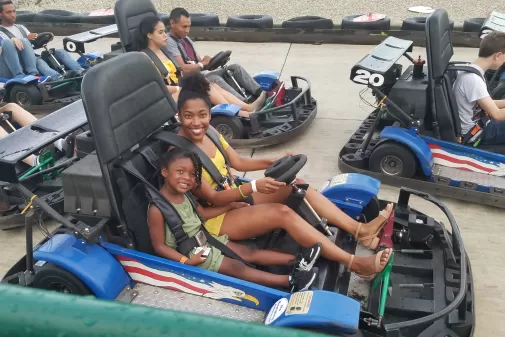 Group playing on go karts