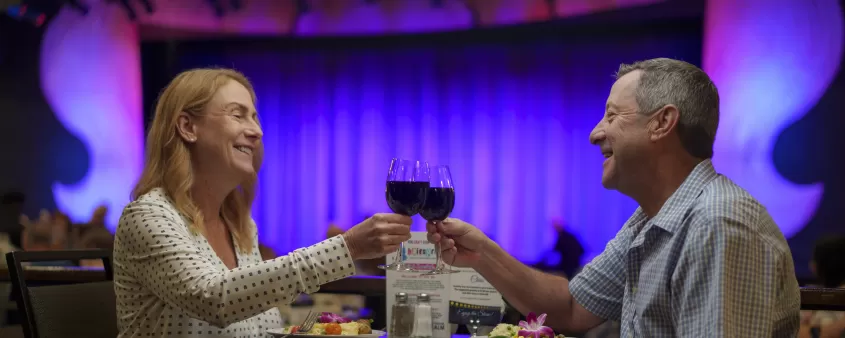 Elderly couple toasting wine at the Broadway Palm Theatre